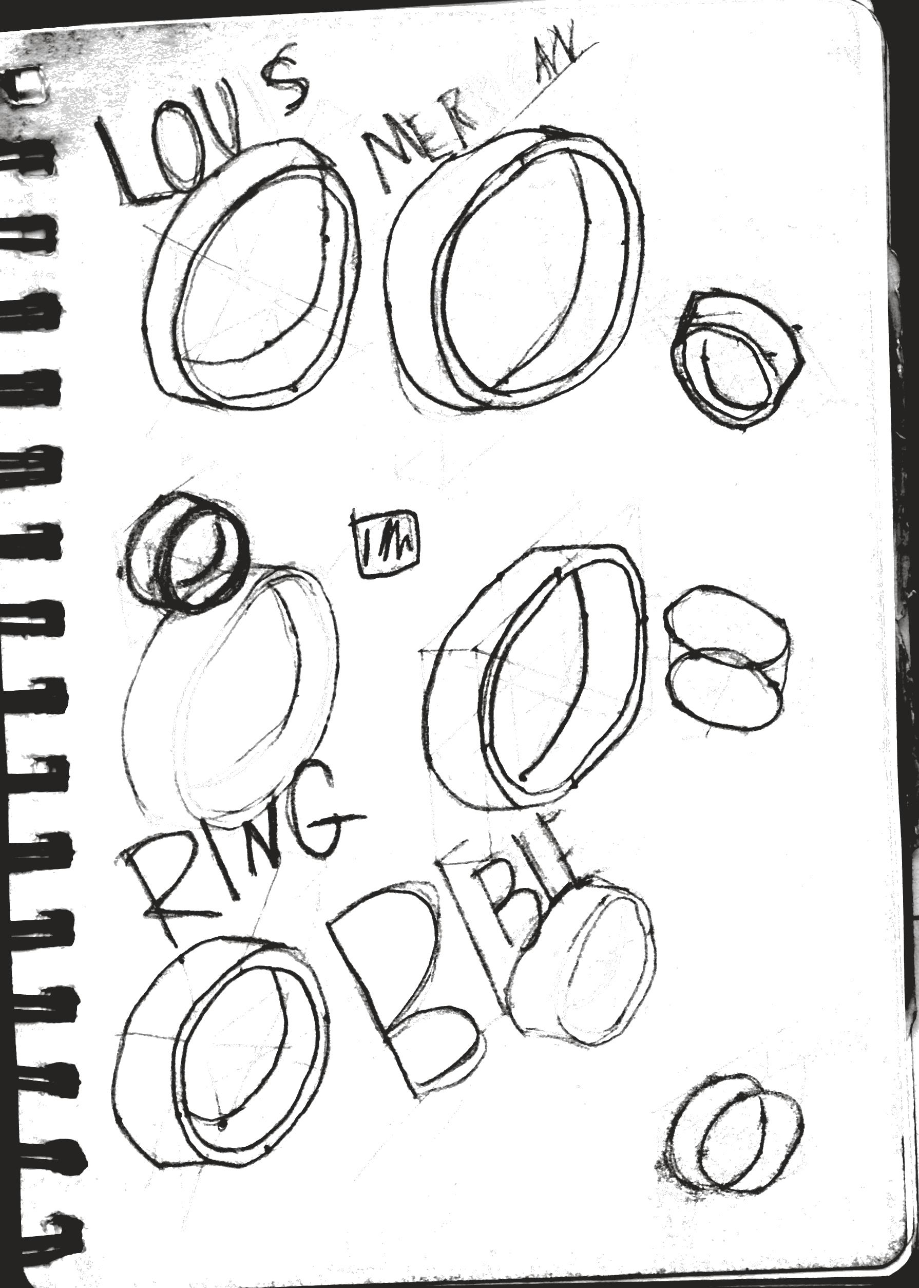 A notebook page of ring sketches and handwritten notes.