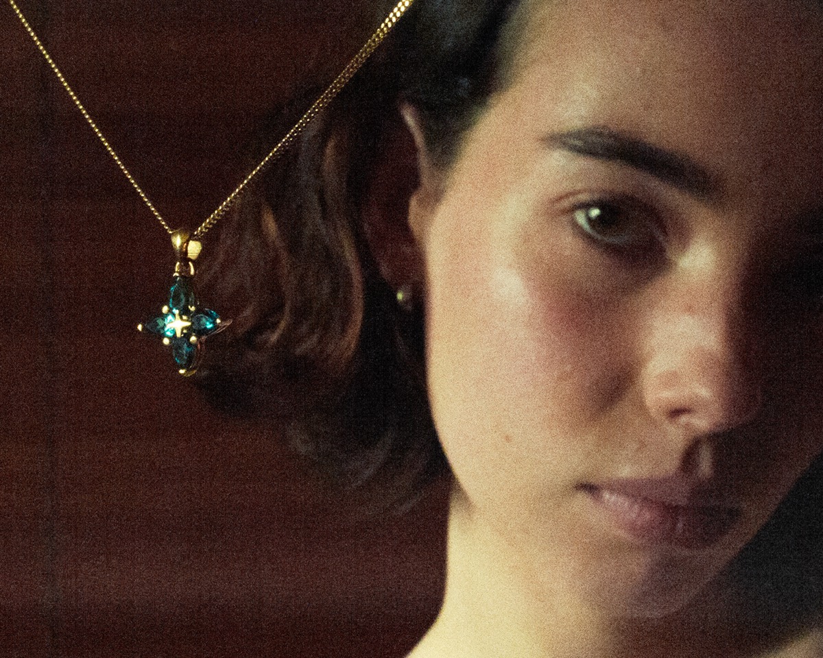 Gold star pendant on a chain