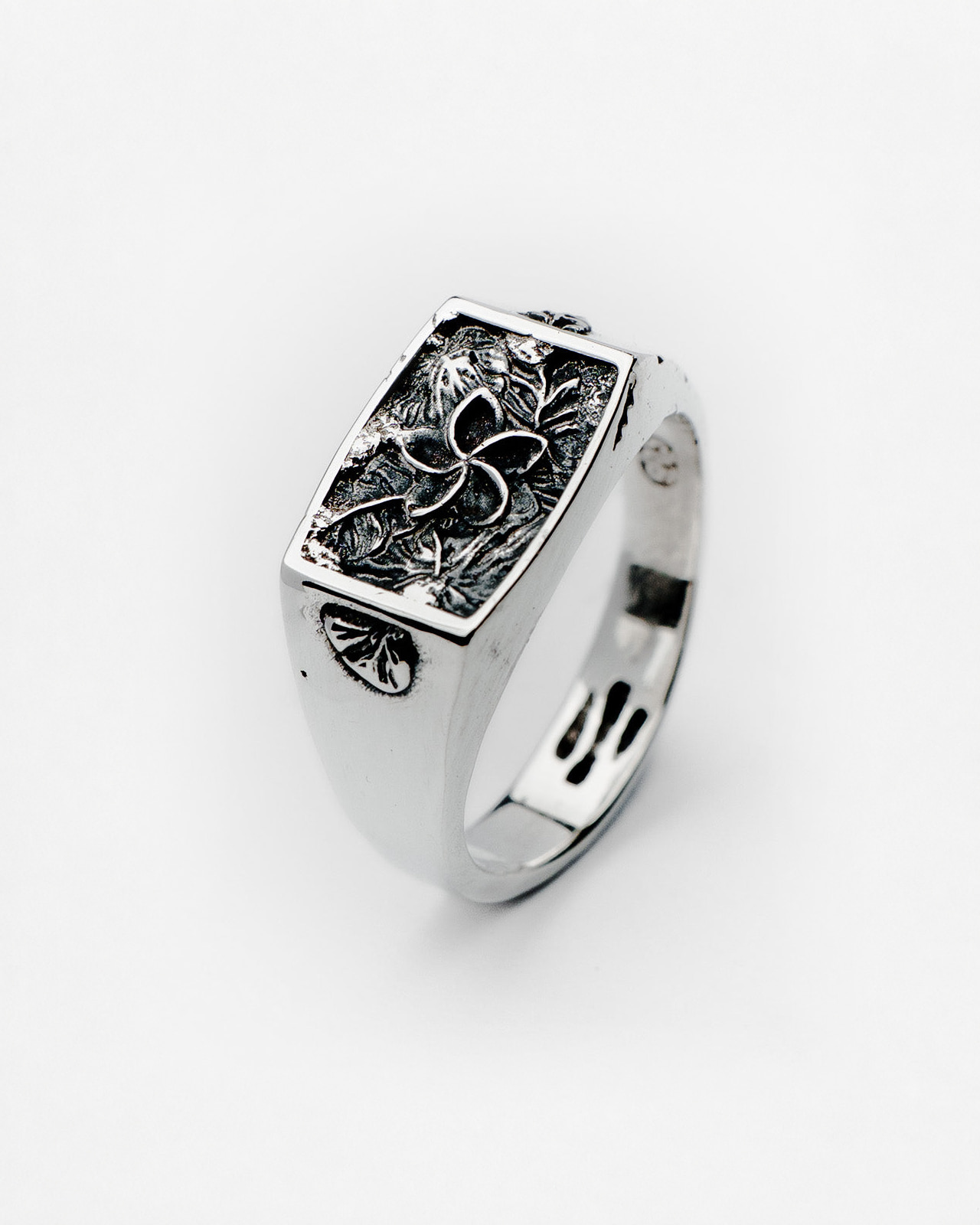 Nascence frangipani ring in sterling silver — angled front view of the sculpted flower