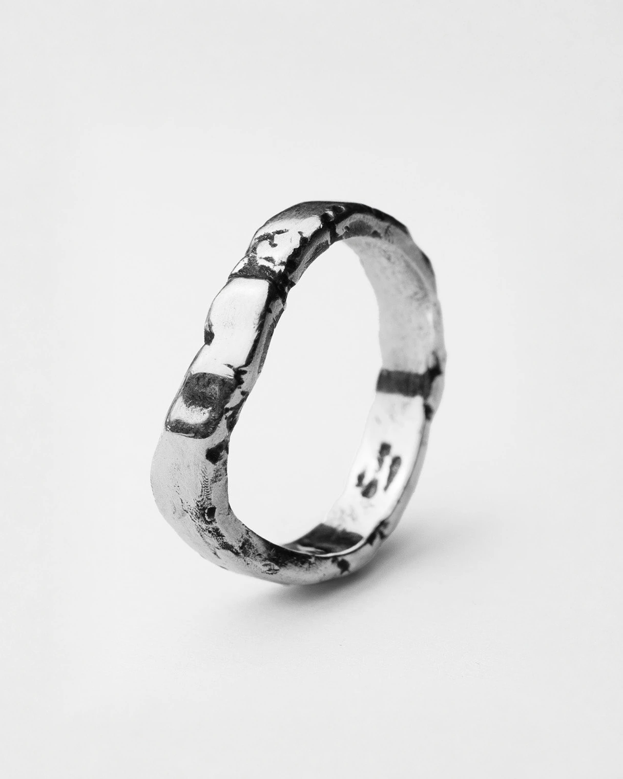 Serene II ring in sterling silver — angled view of the wide organic band