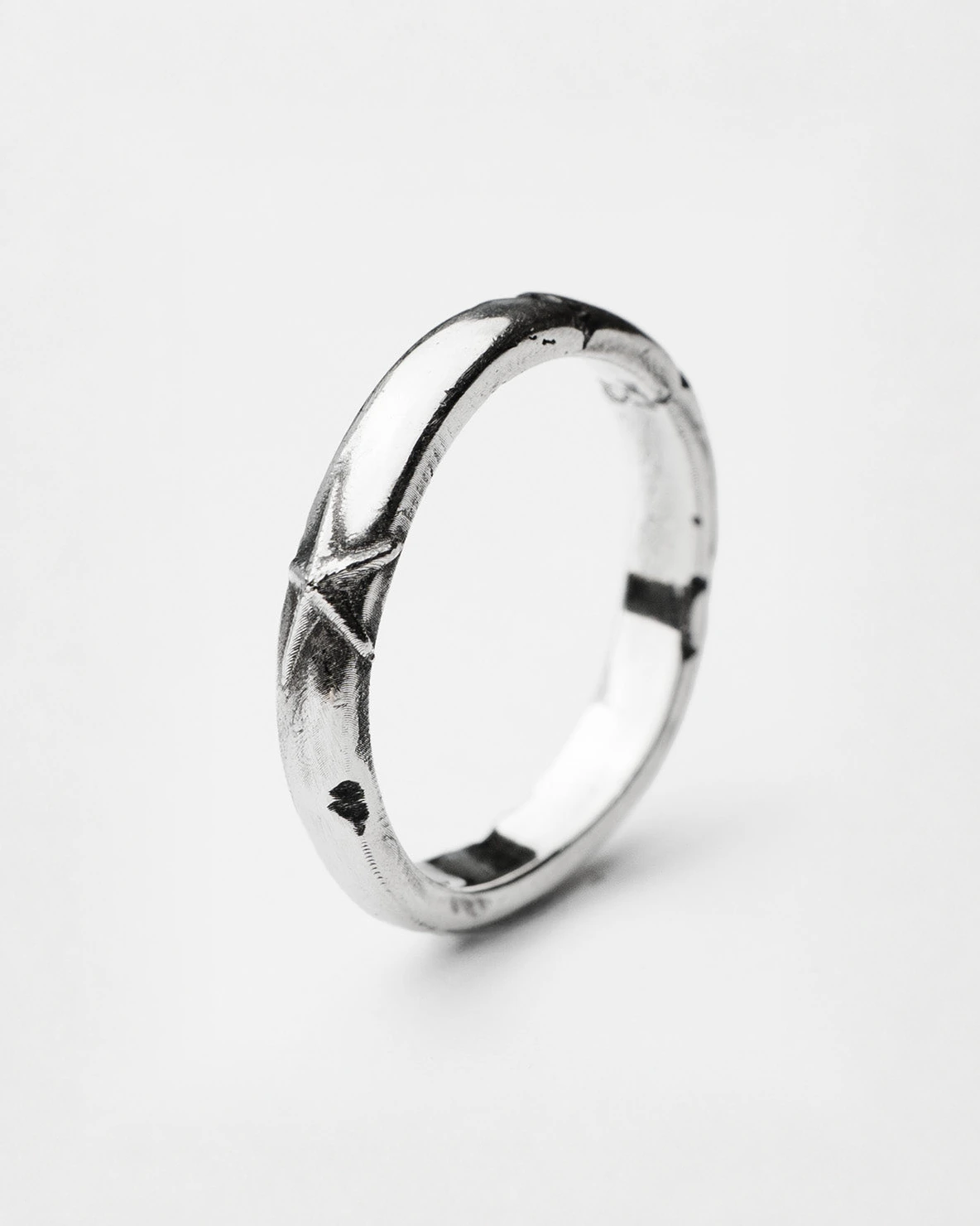 Stellar ring in sterling silver — angled view of the slim band and star detail