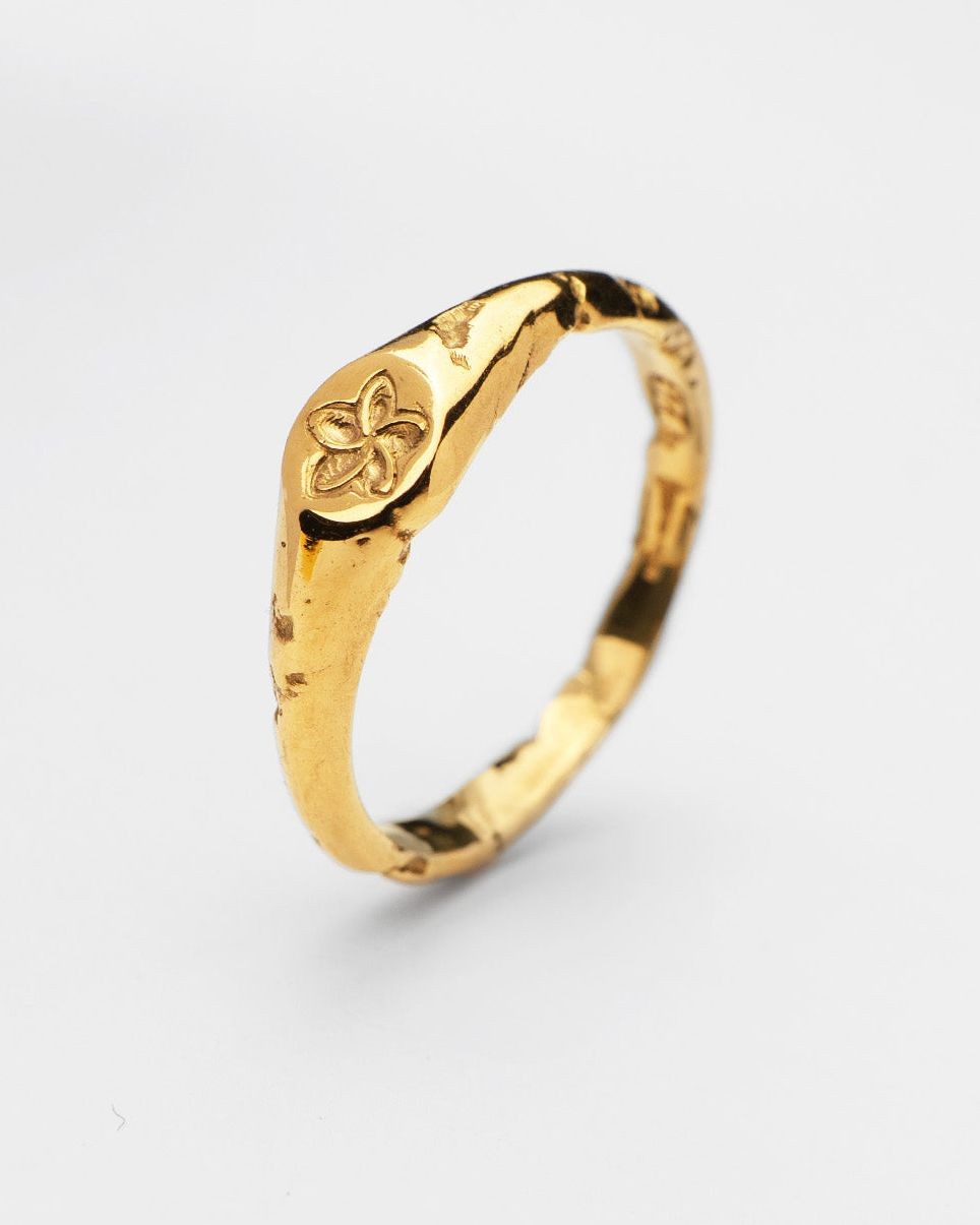 Plumeria ring in 24ct gold plate — angled view of the frangipani motif and organic band