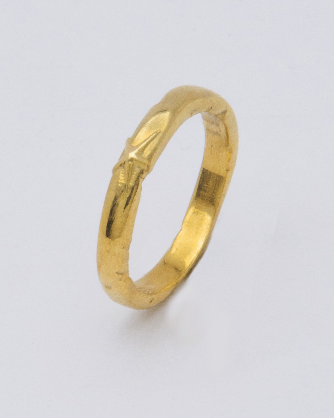 Stellar ring in 24ct gold plate — upright angled view of the star on the slim band